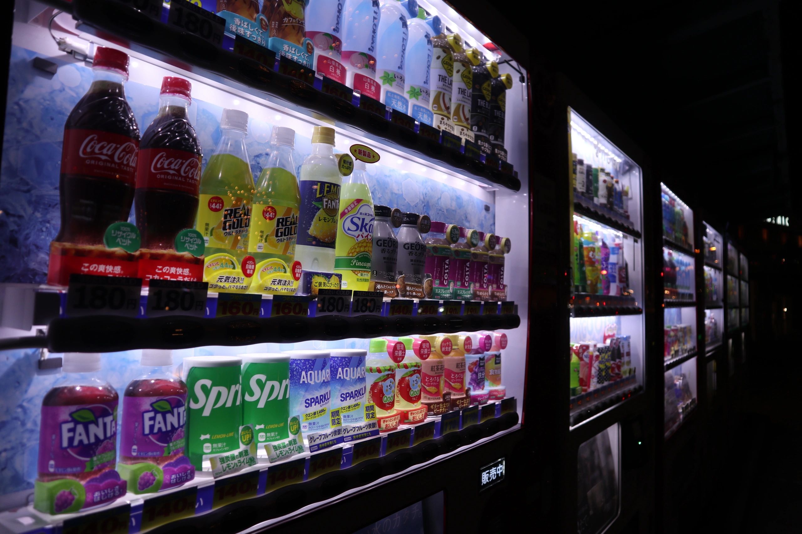 Modern combo vending machine stocked with snacks and drinks